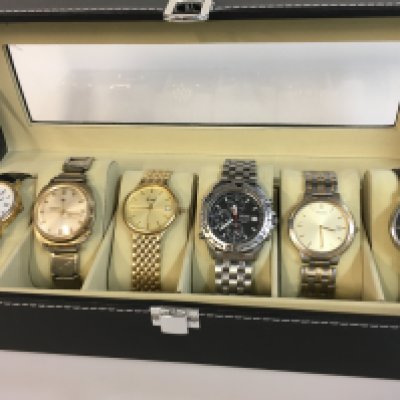 Six vintage mens watches in a display case including Sekonda, Marina, Limit, Seiko, Pulsar, Reflex