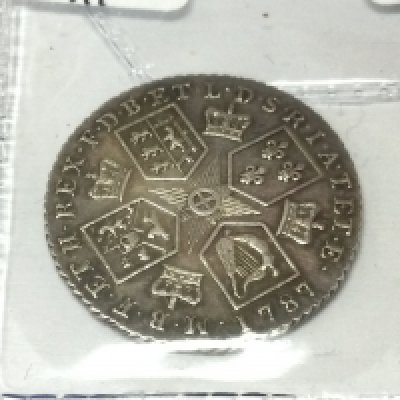 A 1787 GII shilling. Postage A
