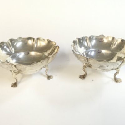 A pair of small silver dishes. 5cm tall, 9cm wide. Postage category A