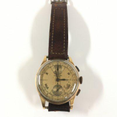 A gold Swiss chronograph watch with an 18ct gold back.