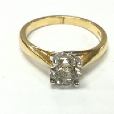 An 18ct gold diamond solitaire ring. Approximately 1.1ct diamond (heavy inclusion) size N and 3.4g