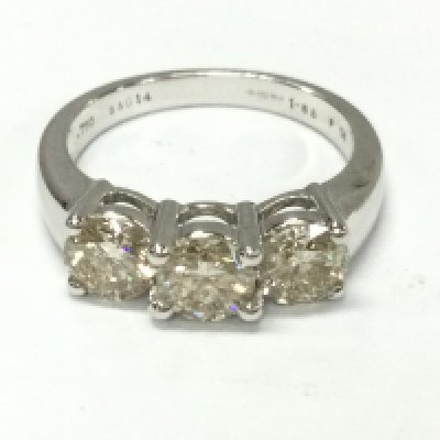 An 18ct white gold three stone diamond ring with approximately 1.5ct and 5.1g and size N
