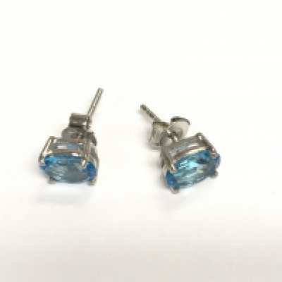 A pair of Swiss blue topaz studs in silver. Shipping category A.