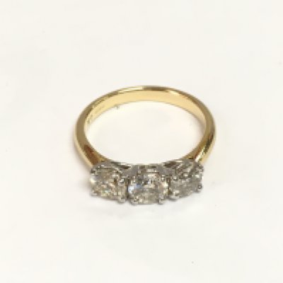 A certificated 18ct white and yellow gold RBC diamond three stone ring. Diamonds approx 1.55ct. Approx 3.7g and approx size M. Cert no WGI9634164256. Shipping category A.