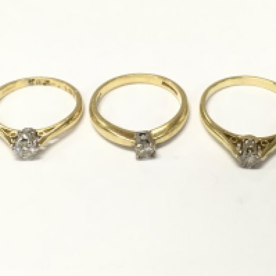 Three 18ct gold diamond solitaire rings. J K and M approximately 7g