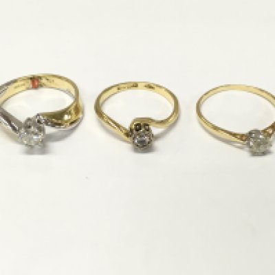 Three 18ct gold diamond solitaire rings. Sizes L and N approximately 9.10g