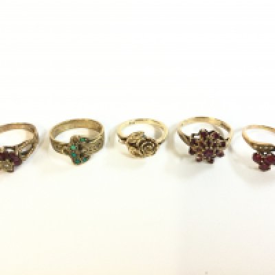 Five 9 carat gold rings , ruby stone set designs and one rose design . Sizes N, J, P. Total weight 14.6g . Postage category A