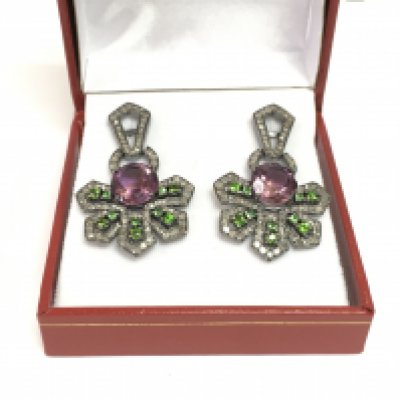A pair of stylised silver and black rhodium drop earrings set with large round amethysts, chrome diopsides and diamonds. Amethysts approx 5.00ct, diopside approx 1.00ct, diamonds approx 1.85ct. Shipping category A.