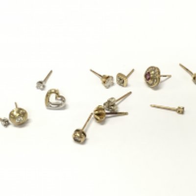 A collection of assorted 9ct gold earrings with various gems including diamonds. Approximately 5.3g