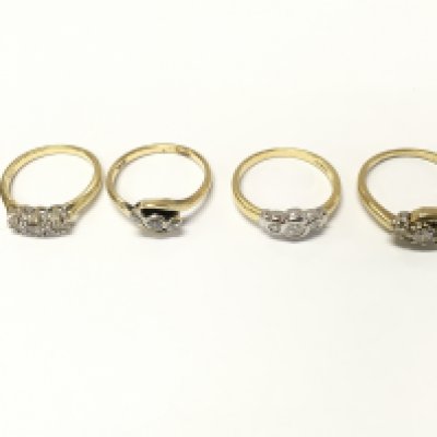 Four 18ct gold diamond three stone rings sizes K N N1/2 approximately 11.7g