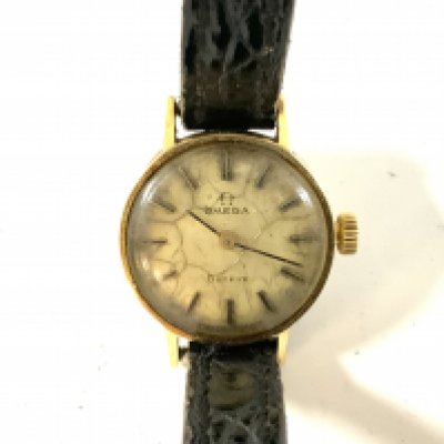 A 14ct gold ladies omega wristwatch.
