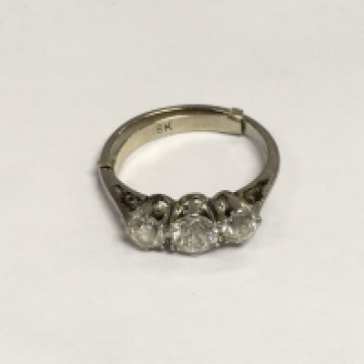 A 1940s platinum three stone diamond ring, approx 3g and approx size H. Shipping category A.