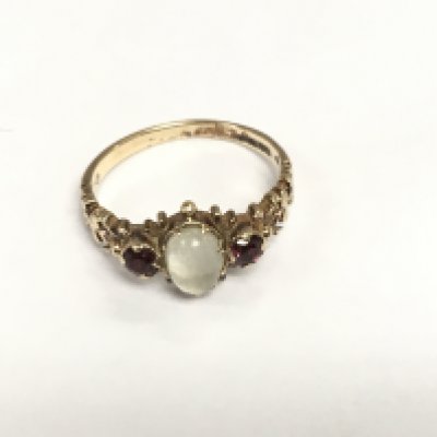 An antique 9ct gold moonstone and garnet ring, approx 2.4g and approx size M-N. Shipping category A.
