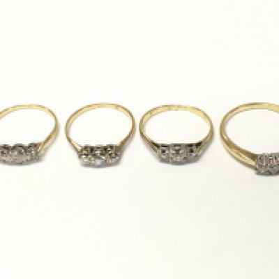 Four unmarked yellow metal three diamond rings. Sizes M N and R approximately 8g