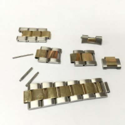 An assorted collection of bi metal links rolex style. Buyer to satisfy themselves with authenticity prior to bidding.