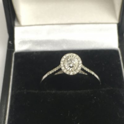A 14ct white gold diamond cluster ring, approx 1.8g and approx size M-N. Shipping category A.