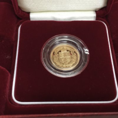 A 2002 proof shield back half sovereign.
