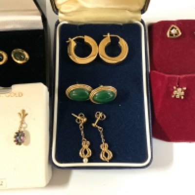 7 pairs of gold and stone set earrings. (A)