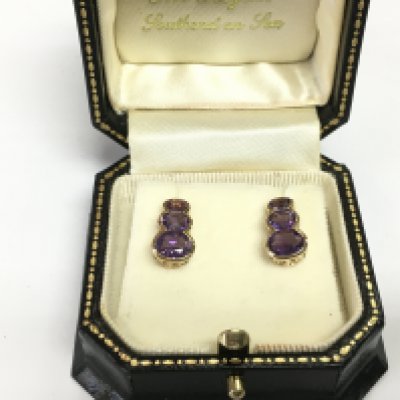 A pair of 9ct gold and amethyst earrings, approx 2.5g. Shipping category A.