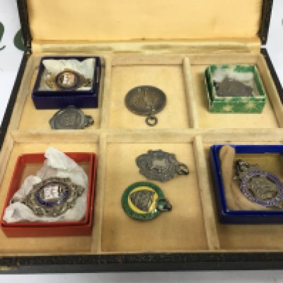 A collection of silver pendants. Shipping category B.