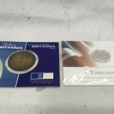 A silver 2001 Britannia and a 2013 fine silver &#201326627520 coin.