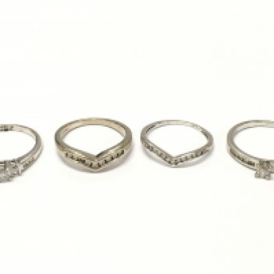 A Collection of 9ct white gold white stone set rings ,7.8g total weight . Sizes L and O. Postage category A