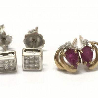 9 carat gold Earrings diamond set and ruby set . 2g total weight .postage category A