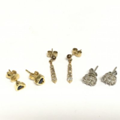 Three pairs of earrings including a pair of diamond cluster studs. Shipping category A.