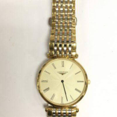 A Longines watch with bi metal strap. Shipping category A.