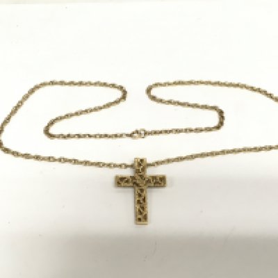 A 9ct gold cross on a 9ct gold chain, approx 12.8g and approx 3.5cm in height. Shipping category A.