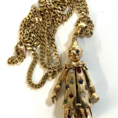 A vintage heavy 9ct gold clown pendant inset with precious stones. 42.2g