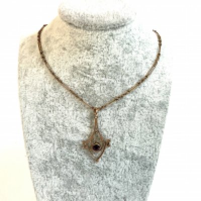 An Edwardian 9ct gold pendant and fancy link chain.