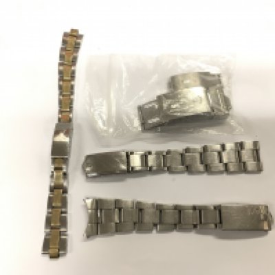 Five steel watch clasps and chains including Rolex examples. Shipping category A.