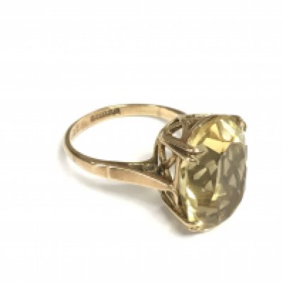 A 9ct gold ring set with a yellow quartz, approx 4.5g and approx size L. Shipping category A.