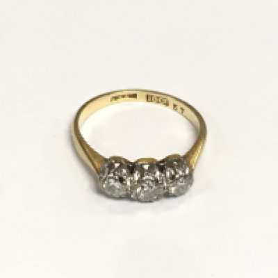 An 18ct gold ring set with three old cut diamonds, approx 2.6g and approx size I-J. Shipping category A.