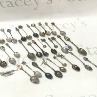 A collection of souvenir spoons including some silver hallmarked examples . Postage category B