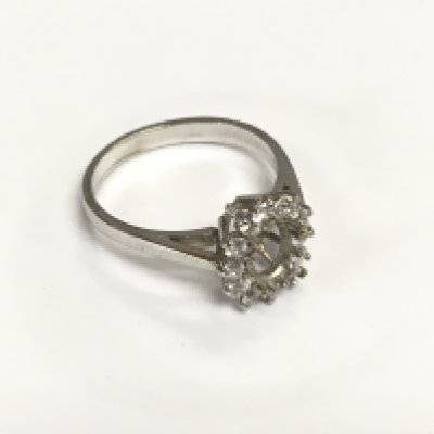 A 9ct white gold ring, no central stone, approx 2.6g and approx size M. Shipping category A.