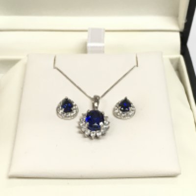 A 9ct white gold necklace and earrings set with CZs and blue simulated sapphires, total approx weight 4g. Shipping category A.