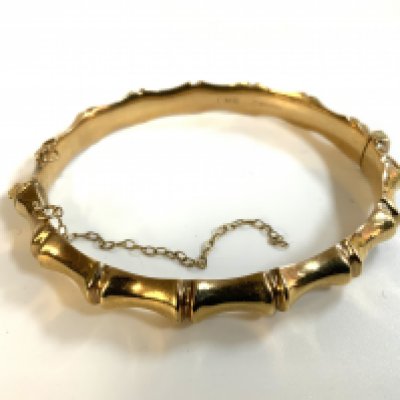 A 9ct gold bamboo design bangle, (A)