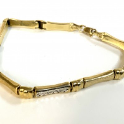 A yellow and white gold bracelet with makers mark, stamped 535 (14K) 19cm.