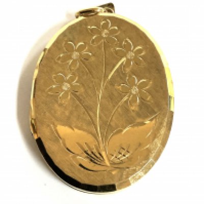 A large 9ct gold double locket with engraved floral decoration. (A)