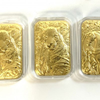 5 0.01g fine gold capsulated pressed panels.
