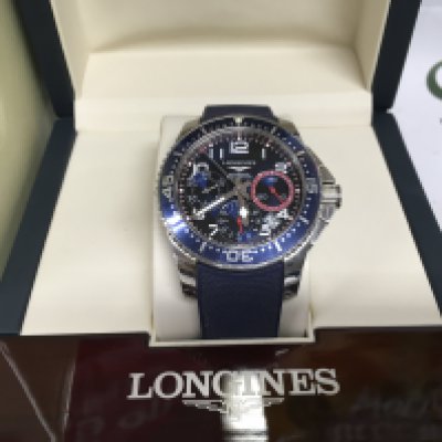 A boxed Longines automatic watch with instruction booklet. Shipping category B.