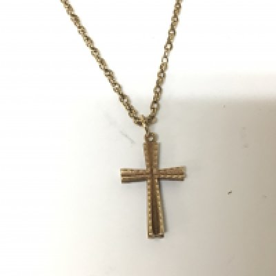 A 9carat gold cross and chain. Weight 6.4g