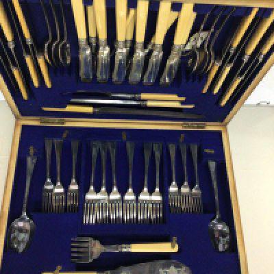An Oak. Canteen of cutlery and a quantity of boxed cutlery.