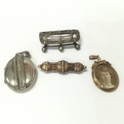 An 9ct gold oval locket 6.75g along with a silver buckle and other items.