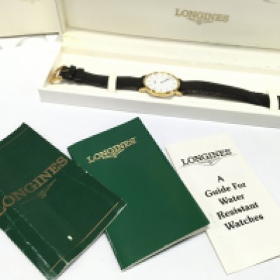 A mens Longines watch, boxed with paperwork . Postage category b