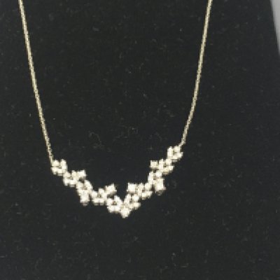 A 14ct white gold diamond cluster necklace. 4.30g approximately.