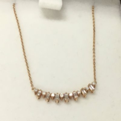 A 14ct rose gold diamond row necklace. Postage B