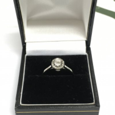 A 14ct white gold diamond ring, approx 1.7g and approx size N. Shipping category A.